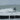 Surfer riding a wave in Kühlungsborn, Ostsee, showcasing the vibrant surfing scene.
